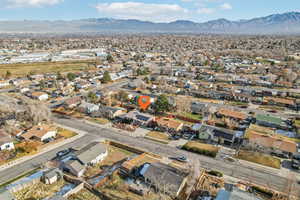 Birds eye view of property with a mountain view