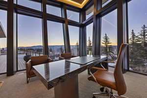 Sunroom / solarium with a mountain view and a wealth of natural light