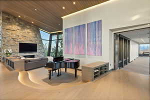 Lobby featuring floor to ceiling windows, high vaulted ceiling, wooden ceiling, and recessed lighting