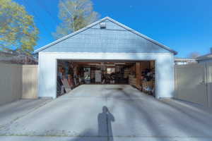 Garage featuring white fridge