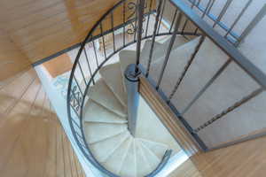 Staircase with hardwood / wood-style flooring