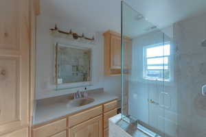 Bathroom featuring vanity and walk in shower