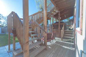 Wooden terrace featuring a storage shed