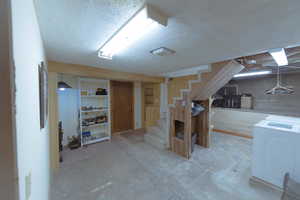 Basement with a textured ceiling