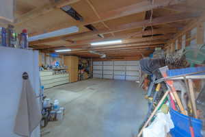 Garage with white refrigerator