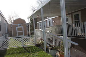 View of home's exterior with a shed