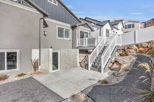 Exterior space with a patio and a deck