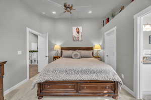 Bedroom featuring ceiling fan and light carpet