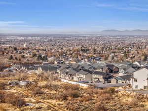 Birds eye view of property with a mountain view