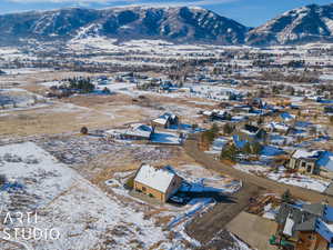 Snowy aerial view with a mountain view