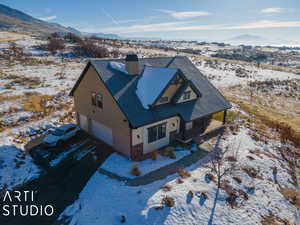 Snowy aerial view with a mountain view