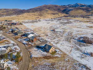 Snowy aerial view with a mountain view