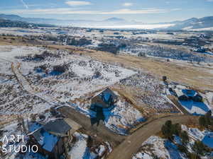 Snowy aerial view with a mountain view