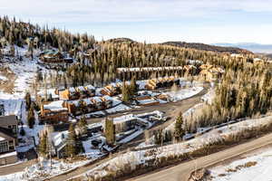 Snowy aerial view featuring a mountain view