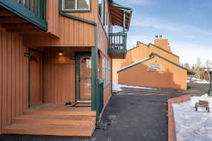 View of snow covered property entrance