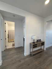 Corridor featuring dark hardwood / wood-style floors