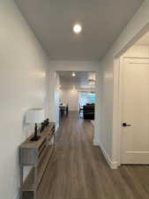 Corridor featuring dark hardwood / wood-style flooring