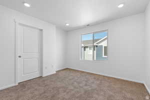 Empty room with carpet flooring