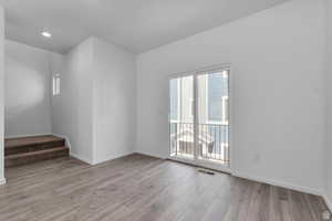 Empty room featuring light hardwood / wood-style flooring