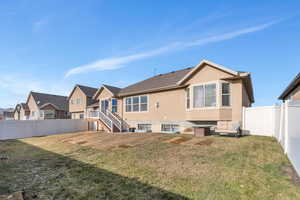 Rear view of house with a lawn