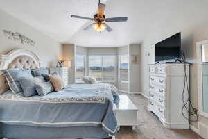 Bedroom with light colored carpet and ceiling fan