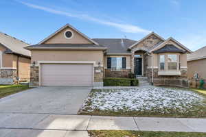 View of front of property featuring a garage