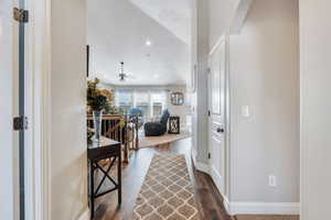 Hallway with dark wood-type flooring