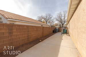 View of side of property featuring a patio area