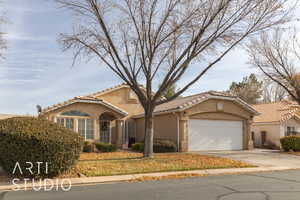 Mediterranean / spanish-style home featuring a garage