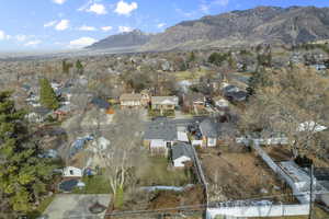 Birds eye view of property with a mountain view