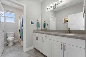 Bathroom featuring vanity and toilet