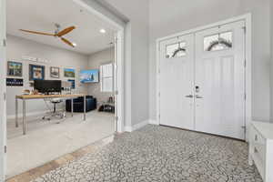 Entryway with ceiling fan and hardwood / wood-style flooring