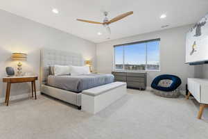 Carpeted bedroom with ceiling fan