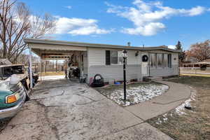 View of front of property with a carport