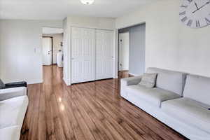 Living room featuring hardwood / wood-style flooring and washer / clothes dryer