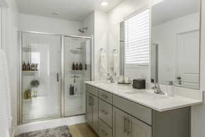 Bathroom with vanity and walk in shower