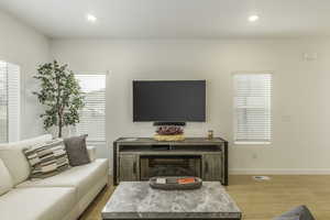 Living room with light wood-type flooring