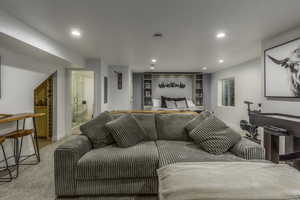 Bedroom with light colored carpet and ensuite bath