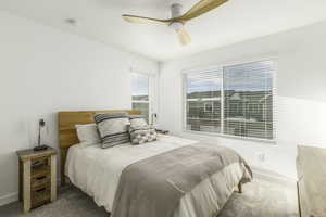 Bedroom with carpet flooring and ceiling fan