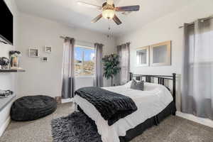 Bedroom with carpet flooring and ceiling fan