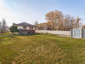 View of yard featuring a storage shed