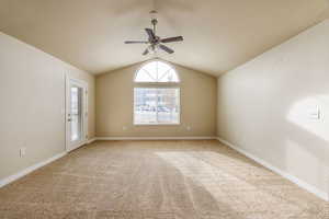 Great room featuring ceiling fan and lofted ceiling