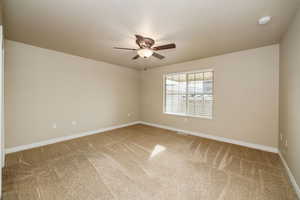 primary bedroom featuring ceiling fan