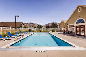 View of pool featuring a patio area, a mountain view, and french doors