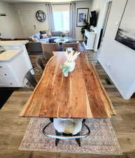 Dining room with dark hardwood / wood-style flooring