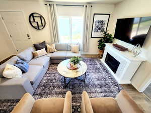 Living room with hardwood / wood-style floors