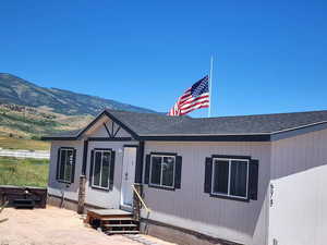 View of front of property with a mountain view