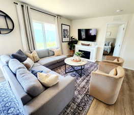 Living room with hardwood / wood-style floors