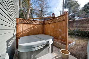 View of patio / terrace with a hot tub