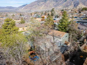 Birds eye view of property with a mountain view